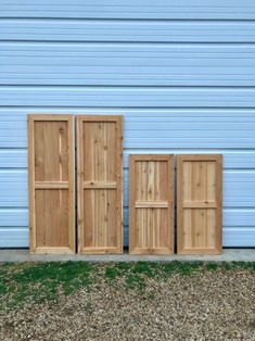 three wooden doors sitting next to each other