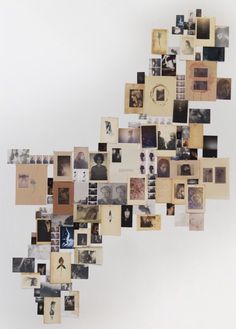 a collage of photographs and photos hanging on the wall in front of a white background