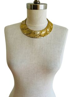 "Elegant Les Bernard collar choker necklace, featuring an Egyptian Revival motif in soft pale gold with a brushed finish. Comprised of 68 interconnected segments through an internal chain, this sophisticated accessory is perfect for achieving your Cleopatra-inspired ensemble! Size: 16\" length. 1-1/4\" wide.  Weight: 216.2 grams. Condition: Very good condition with light gold wear.  Markings: Unmarked. Les Bernard is the maker of this necklace." Medieval Gold Choker Necklace, Egyptian Jewelry Necklaces, Egyptian Necklace Collars, Egyptian Bird, Egyptian Accessories, Egyptian Clothing, Egyptian Necklace, Choker Collar Necklace, Collar Choker