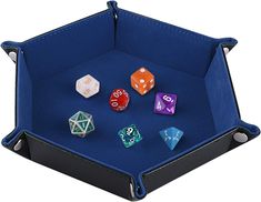 a blue case with six dice in it