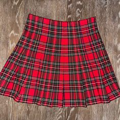 Red Plaid Brandy Melville Pleated Skirt Never Worn Casual Red Flared Skirt, Trendy Red Pleated Skort, Red Casual Mini Skort, Red Casual Mini Length Skort, Casual Red Mini Skort, Red Mini Pleated Tennis Skirt, Red Pleated Mini Tennis Skirt, Trendy Red Pleated Skirt, Casual Fitted Red Tennis Skirt