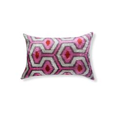 a pink and white pillow with an abstract design on it's side, against a white background