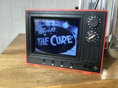 an old fashioned television with the words tell me the curve on it's screen