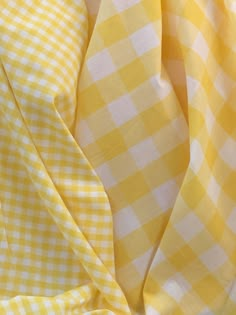 the yellow and white checkered fabric is folded up