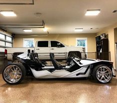 a white and black car in a garage