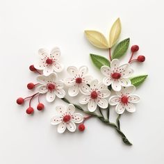 paper flowers with leaves and berries on white background