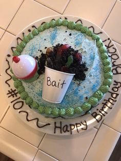 a birthday cake with an ice cream sundae on it and a happy birthday cup