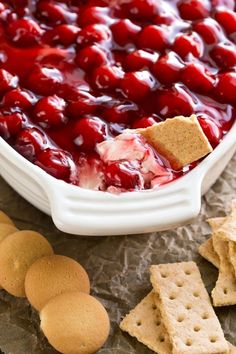 the app is showing an image of cherry cheese dip with crackers on it and other snacks