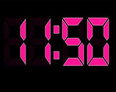 the digital clock is pink and black with numbers on it's face, which appear to be twenty five