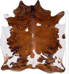 a brown and white cowhide area rug