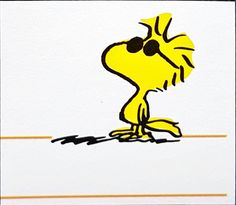 a drawing of a yellow dog with black eyes