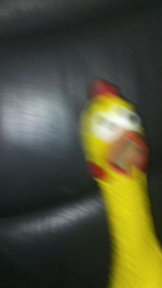 a blurry photo of a person's hand with a yellow glove on it