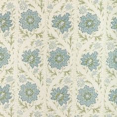 a blue and green floral pattern on fabric