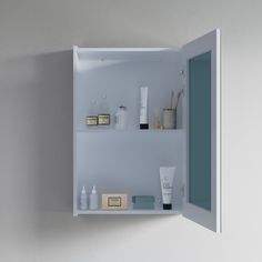 an open medicine cabinet with various items on it