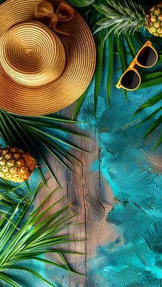 pineapples, sunglasses and straw hats on a blue background with palm leaves in the foreground