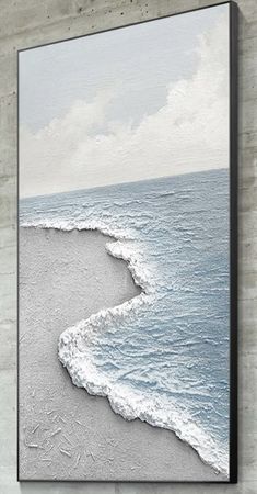 an ocean scene with waves coming in from the water and clouds above it, framed on a concrete wall