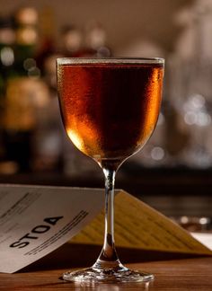 a close up of a wine glass on a table