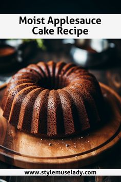 a bundt cake sitting on top of a wooden plate with the words, moist applesauce cake recipe