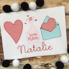 love potion natalie machine embroidery pattern on white paper with black pom poms