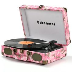 a pink camouflage suitcase with an old record player in the middle and words udreamer on it