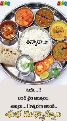 a metal plate topped with lots of different types of food on top of a white table