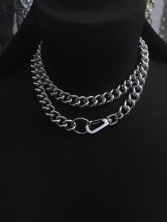 Make an edgy statement with this stunning Chunky Chain Goth Choker Layered Necklace Set! Crafted with steel curb chain and stainless steel push clasp, this modern and sophisticated necklace comes with a bit of punk rock edge, perfect to challenge your style. Light up any outfit and rock the night away! Wear long or doubled as a choker. Total length end-to-end is approximately 32 inches. Cheap Punk Choker For Festivals, Metal Chain Link Necklace For Streetwear, Streetwear Metal Necklace With Chunky Chain, Adjustable Metal Chain Necklace For Streetwear, Metal Link Necklaces For Streetwear, Metal Chain Necklace For Streetwear, Edgy Double Chain Link Necklace, Streetwear Link Metal Necklaces, Streetwear Metal Link Necklace