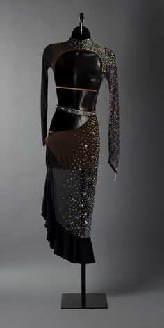 a mannequin wearing a dress with sequins on it