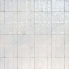 a white tiled wall with no one in it