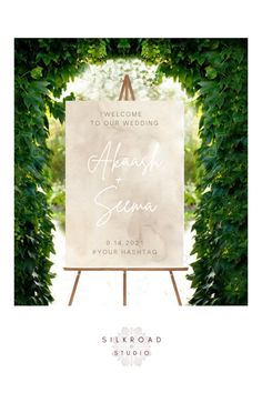 a welcome sign with the words, welcome to our wedding and an easel in front of it