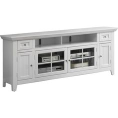 a white entertainment center with drawers and doors