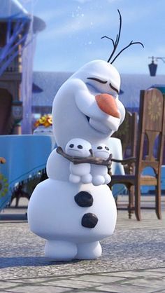 the character from disney's frozen world is hugging her baby