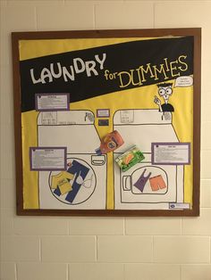 a laundry for dummies poster hangs on the wall in front of a bulletin board