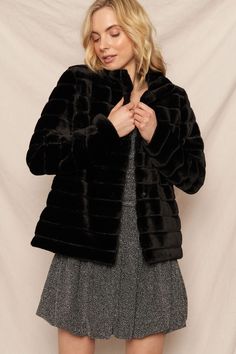 A model dressed in a black plush fur jacket and a gray glittery dress, gently pulling her jacket together with a soft expression. Holiday Glam Outfits, Baseball Cap Summer, Black Faux Fur Jacket, Crinkle Top, Petal And Pup, Glam Outfit, Plus Size Cardigans, Easter Outfit, Cropped Style