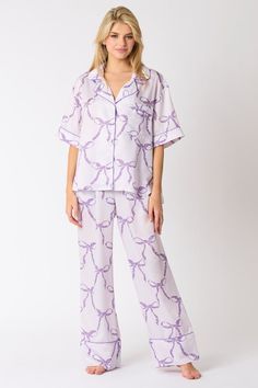 Light purple satin pajama pants with dark purple bow tie print You'll have the Sweetest Dreams in these purple satin pajama pants! Featuring a light purple satin fabric with dark purple bow tie print, an elastic waistband, front pockets, and wide legs with dark purple trimmed cuffs. Perfect for bedtime, or comfy lounging. Grab the matching top and get ready to trend while your sleep! Fits true to size; relaxed silhouette Fabric contains stretch Model is wearing a small Elastic waistband Front po Purple Pajamas Aesthetic, Purple Pjs, Purple Pajama Pants, Sleep Fits, Pajamas Aesthetic, Purple Pajamas, Satin Pajama Pants, Sweetest Dreams, Purple Bow Tie