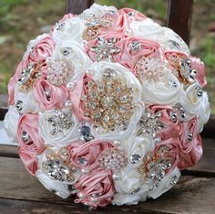 a bridal bouquet sitting on top of a wooden bench