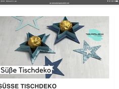 an image of some paper stars with gold and silver decorations in them on the table