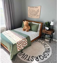 a teddy bear sitting on top of a bed in a bedroom