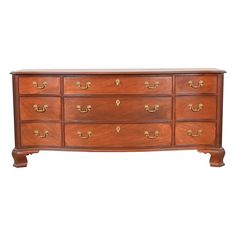 a wooden dresser with many drawers and handles