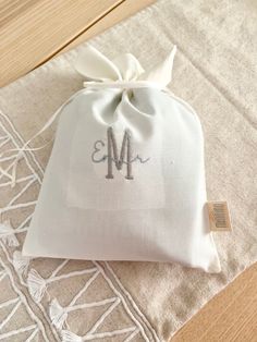 a white bag with the letter m on it