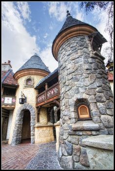 a castle like building with a stone walkway leading to it