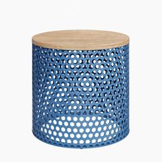 a blue metal and wood stool with holes on the top, sitting against a white background