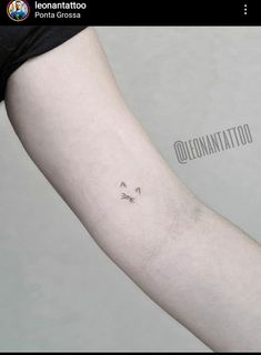 a person with a small tattoo on their arm