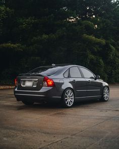 a black car parked in a parking lot