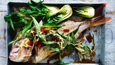 an overhead view of fish and vegetables on a tray