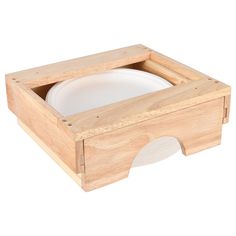 a wooden box with a white plate in it