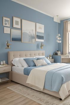 a bedroom with blue walls and pictures on the wall above the bed, along with an area rug