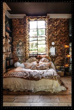 a bed sitting under a window in a bedroom