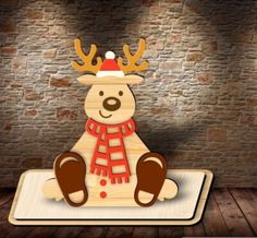 a wooden cutout of a reindeer wearing a hat and scarf sitting on top of a rug