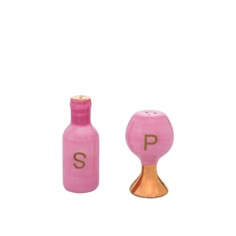 two pink salt and pepper shakers sitting next to each other