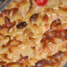 a casserole dish with raisins and cherries in it, ready to be eaten